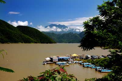 Fishing boats awaiting customers at the pier on Aguamilpa Lake.