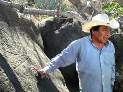 Carlos Lopez with petroglyphs