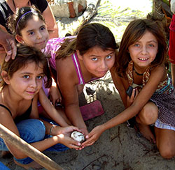 Kids caring for crocodile eggs