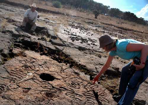 Ilse Taylor with petroglyph at Presa de la Luz