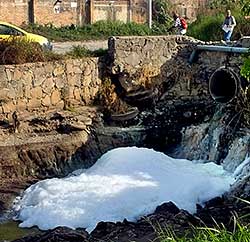 Human waste pours into the Ahogado River