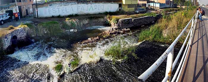 Jess Moreno photographs wastewater flowing out of Las Pintas Lake